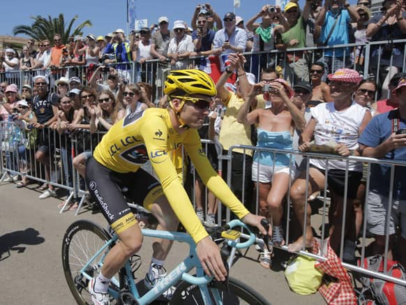 Jan Bakelants of Belgium, wearing the overall leader`s yellow jersey, arrives for the start of the third stage of the Tour de France cycling race over 145.5 kilometers (91 miles) with start in Ajaccio and finish in Calvi, Corsica island, France.