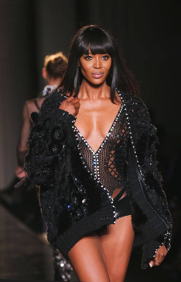 Naomi Campbell wears a creation by fashion designer Donatella Versace during her Women`s Fall Winter 2013 haute couture fashion collection in Paris.