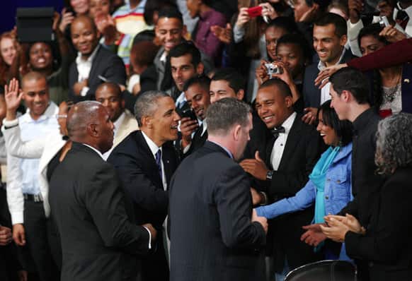 US President Barack Obama greets the public as he arrives to deliver remarks and takes questions at a town hall meeting with young African leaders at the University of Johannesburg Soweto campus.