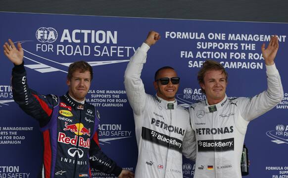 Mercedes driver Lewis Hamilton of Great Britain celebrates after winning the pole position following the qualifying session at the Silverstone circuit, England.