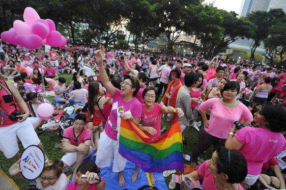 Two women cheer at a rally called the