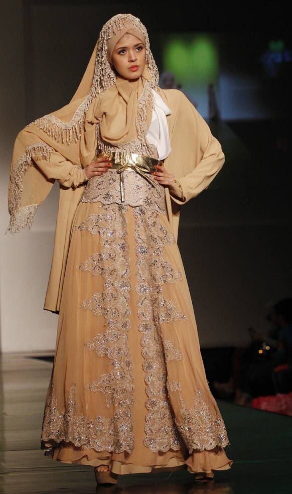 A model presents a creation by Indonesian fashion designer Rudy Chandra during the Islamic Fashion week in Jakarta, Indonesia.
