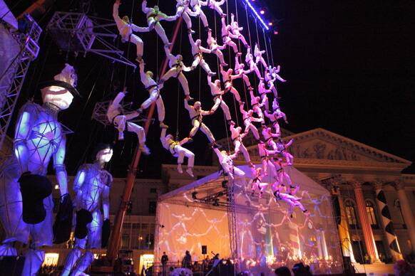Actors perform with huge puppets during an open air event in front of the Munich opera, southern Germany. Munich celebrates the 200. birthday of composers Richard Wagner and Guiseppe Verdi.