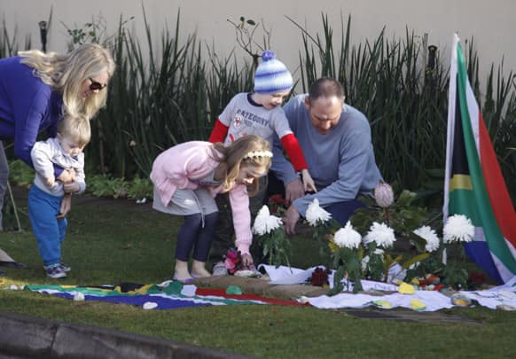 Get well wishes and flowers are placed outside the Johannesburg home of former President Nelson Mandela.
