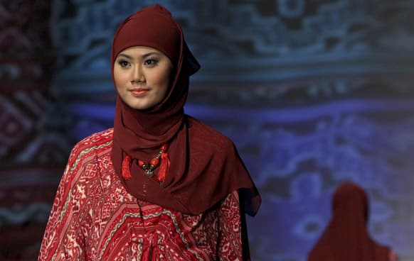 A model presents a creation by Indonesian fashion designer Itang Yunasz during the Islamic Fashion week in Jakarta.