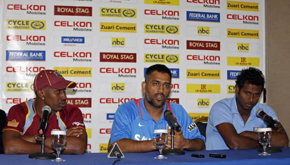 India`s cricket team captain Mahendra Singh Dhoni, center, speaks as his counterparts Angelo Mathews of Sri Lanka, right, and Dwayne Bravo of the West Indies listen during the launching of the Tri-Nation cricket tournament in Kingston, Jamaica.