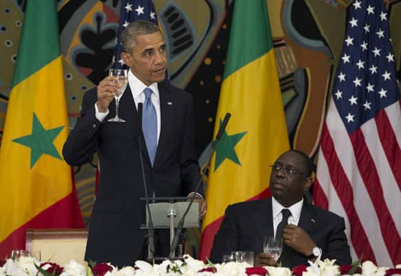 US President Barack Obama, left, makes a toast during an official dinner with Senegalese President Macky Sall at the Presidential Palace.