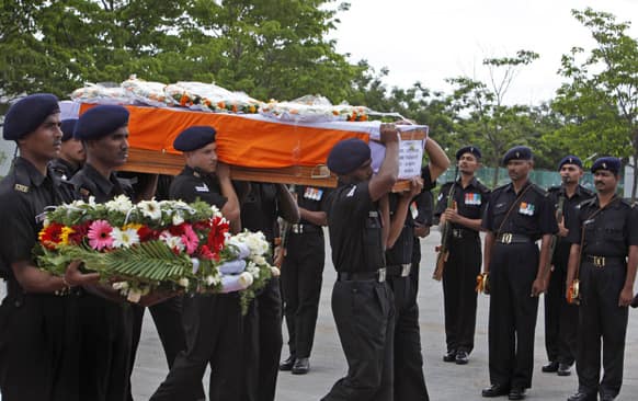 Indian army soldiers pay their last tributes to fellow soldier Yadaiah. M, as his body is taken for final rites, in Hyderabad. Yadaiah was among five soldiers who were killed on June 24, 2013 in an attack by militants on their army convoy in Srnagar.