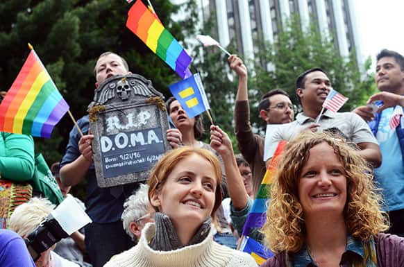 Kara Mineehan and Kim Walsh celebrate the Supreme Court`s decision to rule the same-sex marriage ban as unconstitutional. The event was hosted by Oregon United for Marriage with several guest speakers.