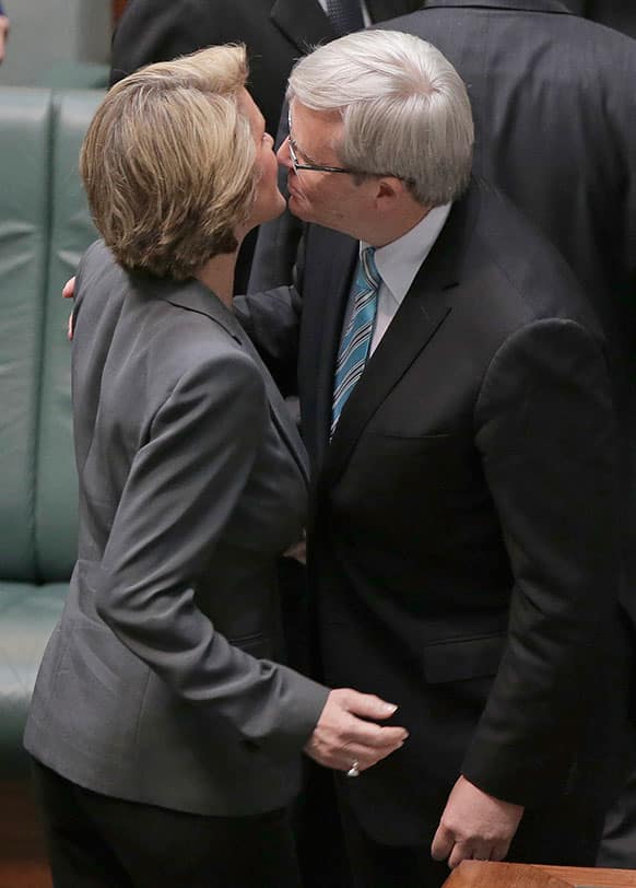 Australian Prime Minister Kevin Rudd kisses the deputy leader of the opposition Julie Bishop just before he addresses Parliament for what is likely to be its last day before elections, in Canberra, Australia.