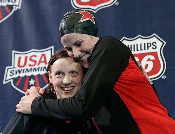 Missy Franklin hugs Katie Ledecky on the podium after Franklin won the women`s 200-meter freestyle during the US National Championships swimming meet, in Indianapolis. Franklin won in 1 minute, 55.56 seconds.