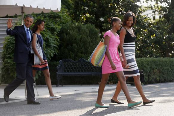 President Barack Obama, first lady Michelle Obama, with daughters Sasha and Malia, leave the White House in Washington to board the Marine One helicopter for a short trip to Andrews Air Force Base, Md., then onto Senegal, Tanzania, and South Africa.