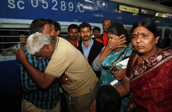 Pilgrim Rahava Chary, who was stranded after flash floods and landslides in Uttarakhand state, hugs his family members on his arrival in Hyderabad.