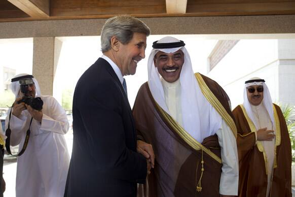 US Secretary of State John Kerry is greeted by Kuwaiti Foreign Minister Sheik Sabah Khalid Al Hamad Al Sabah, before their meeting at Bayan Palace in Kuwait City.