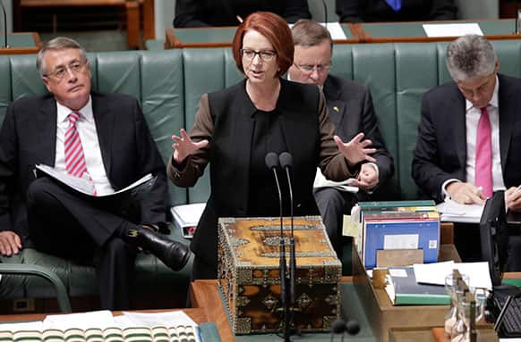Australian Prime Minister Julia Gillard speaks in parliament in Canberra, Australia. Supporters of Gillard`s chief intra-party rival are again pushing for a vote to oust the Australian prime minister this week.