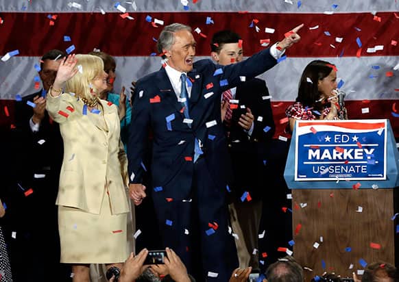 Confetti falls on Democratic US Rep. Edward Markey, holding hands with his wife, Dr. Susan Blumenthal, as they celebrate his victory in the Massachusetts special election for the US Senate at his campaign party in Boston.