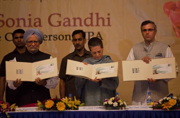 Prime Minister Manmohan Singh, Congress Party President Sonia Gandhi and Chief Minster of Jammu and Kashmir Omar Abdullah release a postal stamp of Kashmiri poet Peerzada Ghulam Ahmad Mehjoor.