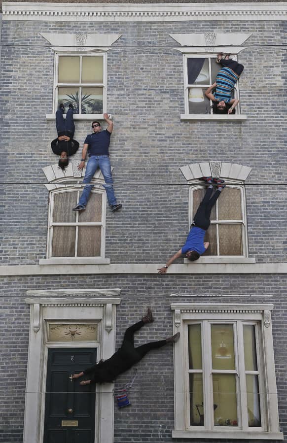 Visitors enjoy an art installation by Argentinan artist Leandro Erlich in London. Internationally known for his captivating, three-dimensional visual illusions, Argentine artist Leandro Erlich has been commissioned to create a new installation in Dalston, London.