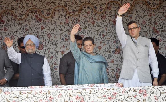 Prime Minister Manmohan Singh, Congress Party President Sonia Gandhi and Chief Minster Jammu and Kashmir Omar Abdullah wave to the crowd during the foundation stone lying ceremony of the 850 MW Rattle hydro power project in Kishtwar district of the Jammu.