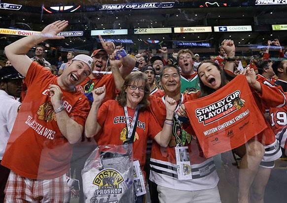 Chicago Blackhawks fans celebrate after the Blackhawks beat the Boston Bruins 3-2 in Game 6 of the NHL hockey Stanley Cup Finals in Boston.
