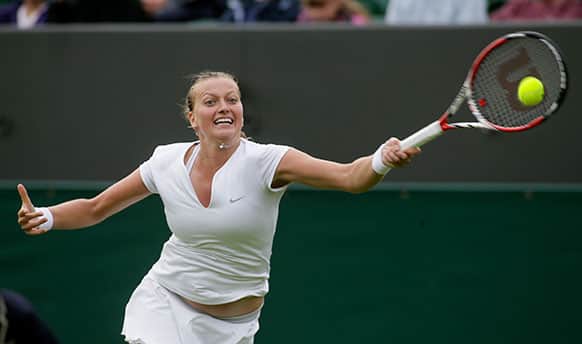 Petra Kvitova of the Czech Republic returns to Coco Vandeweghe of the United States during their Women`s first round singles match at the All England Lawn Tennis Championships in Wimbledon, London.