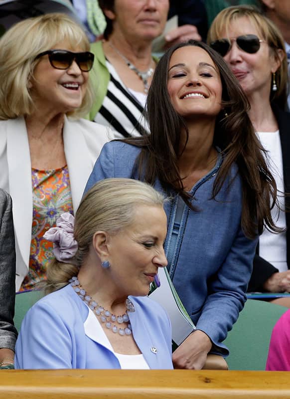 Pippa Middleton, right, the sister of Britain`s Duchess of Cambridge Kate Middleton, takes her seat alongside Princess Michael of Kent, front left, and actress Felicity Kendall at the All England Lawn Tennis Championships in Wimbledon.