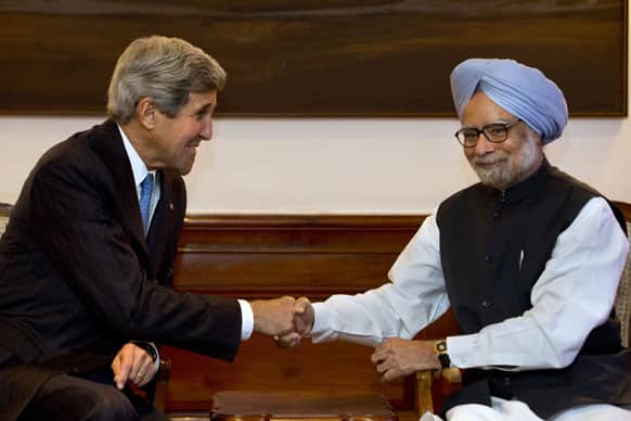 US Secretary of State John Kerry, shakes hands with Indian Prime Minister Manmohan Singh during their meeting at the prime minister`s residence in New Delhi.