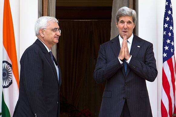 US Secretary of State John Kerry gestures to the media at the end of a photo opportunity with Indian External Affairs Minister Salman Khurshid at Hyderabad House in New Delhi.