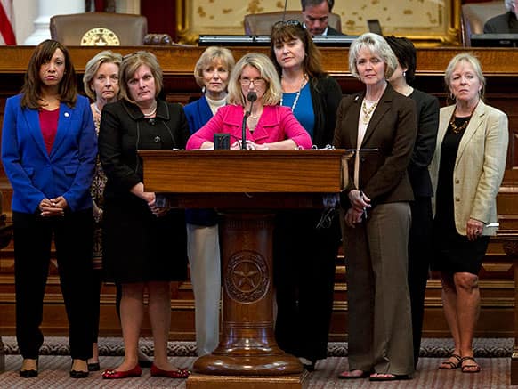Rep. Jodie Laubenberg, R-Parker, center, sponsor of Senate Bill 5, is flanked by fellow Republicans during the second reading of the abortion bill on the House floor of the Texas State Capitol in Austin, Texas.