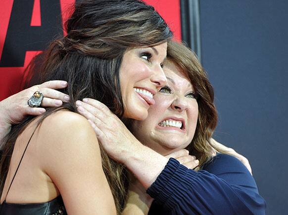 Actors Sandra Bullock, left, and Melissa McCarthy attend
