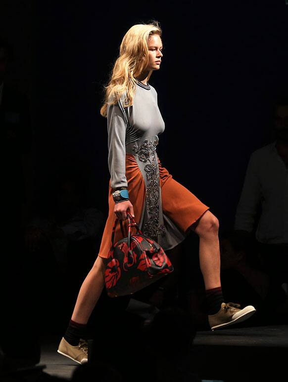 A model wears a creation for Prada men`s Spring-Summer 2014 collection, part of the Milan Fashion Week, unveiled in Milan, Italy.