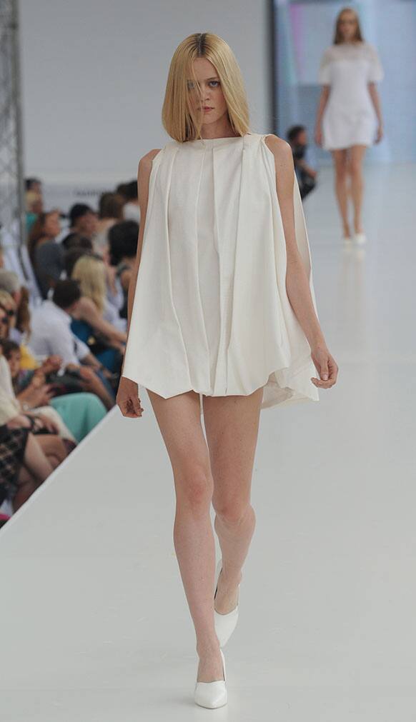 A model presents a creation by Polish designer Maria Mrowca during the Warsaw Fashion Street show held on one of the main streets in Warsaw, Poland.