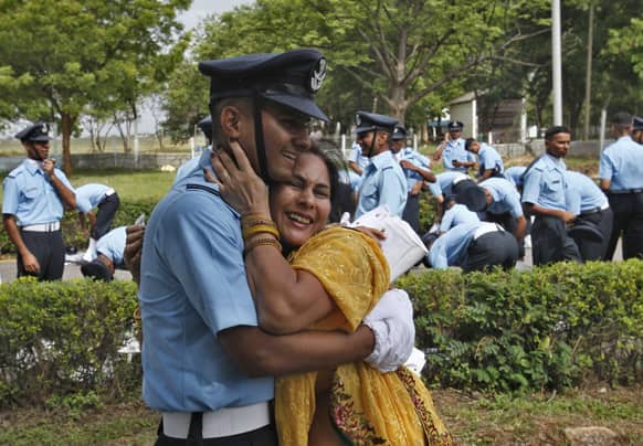 An Indian Air Force (IAF) cadet hugs his mother after participating in the passing out ceremony at the Air Force Academy in Dundigal, 40 Kilometers (25 miles) from Hyderabad.