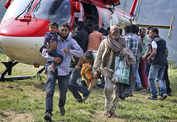 Pilgrims who were stuck in the upper reaches of mountains are brought to safer place, in Joshimath, Uttrakhand.