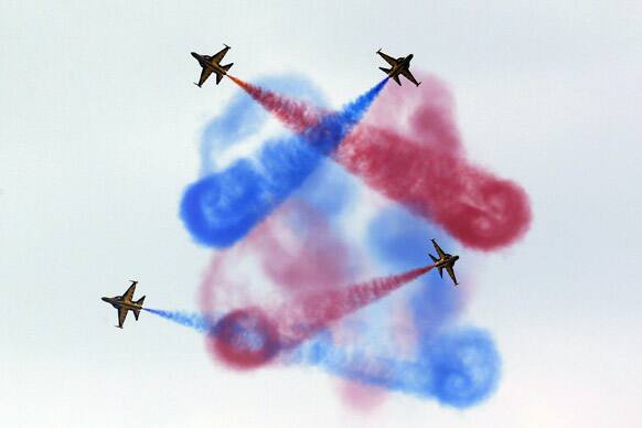 South Korean Air Force aerial demonstration team, the Black Eagles, performs during a ceremony for a re-enactment of the battle of Chuncheon in Chuncheon, north of Seoul, South Korea.