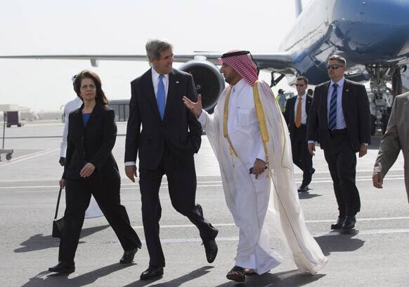 US Ambassador to Qatar Susan Ziadeh walks with US Secretary of State John Kerry and Ambassador Ibrahim Fakhroo, Qatari Chief of Protocol, on Kerry`s arrival in Doha, Qatar.