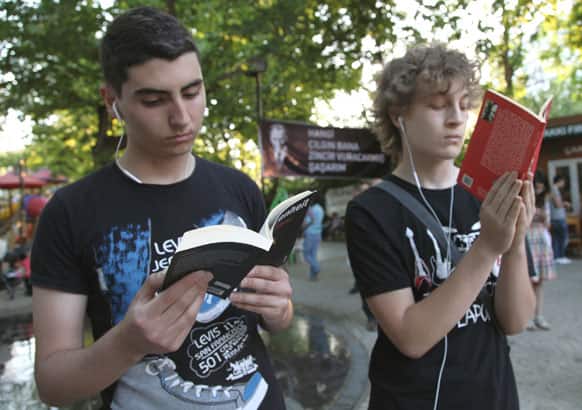 Young Turks read as they stand in a silent protest in Kugulu Park in Ankara. After weeks of sometimes-violent confrontation with police, Turkish protesters have found a new form of resistance, standing still and silent.