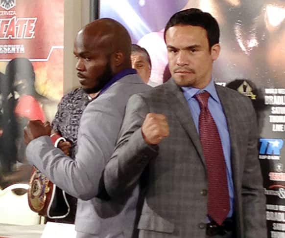Undefeated WBC champion Timothy Bradley, Jr., left, poses with Juan Manuel Marquez during a news conference, in Los Angeles.