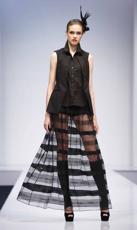 A model presents a creation by Malaysian designer Villiam Ooi during the Kuala Lumpur Fashion Week in Kuala Lumpur, Malaysia.