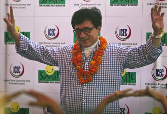Hong Kong movie star Jackie Chan gestures during his visit at the non-governmental organization Smile Foundation in New Delhi.