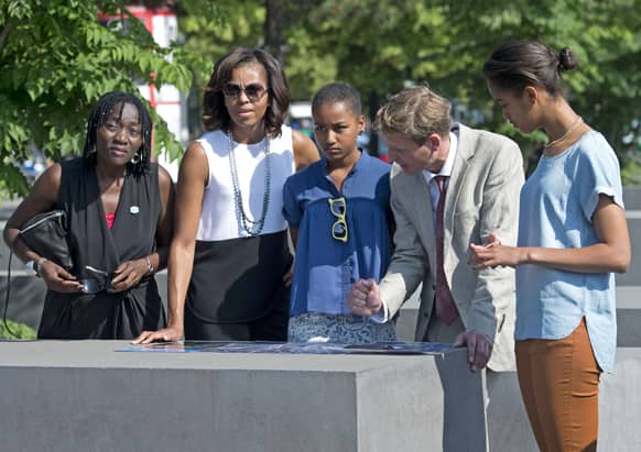 US first lady Michelle Obama, visits the Holocaust Memorial besides her husband`s half sister Auma Obama, her daughters Sasha and Malia and Uwe Neumaerker, director of the foundation for the memorial, in Berlin, Germany.