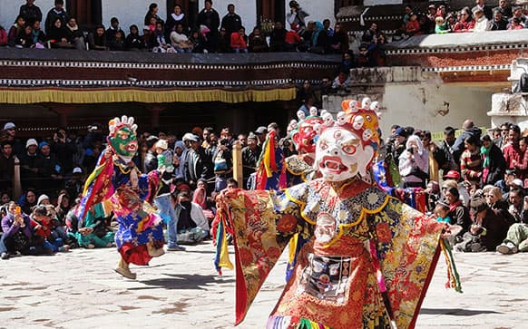 Buddhist monks in traditional attire perform a dance on the first day of the annual festival of sacred dances at the Hemis Gompa monastery, some 45 Kilometers (28 miles) southeast of Leh.