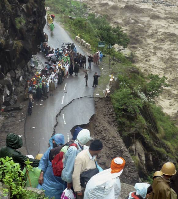 Indo-Tibetan Border Police (ITBP) arrive to rescue stranded Sikh devotees from Hemkunt Sahib Gurudwara, a religious Sikh temple, to a safe place in Chamoli district, in northern Indian state of Uttarakhand.