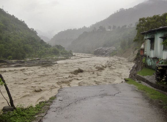 Flooded Badrinath highway road is seen near Joshimath district in northern Indian state of Uttarakhand.