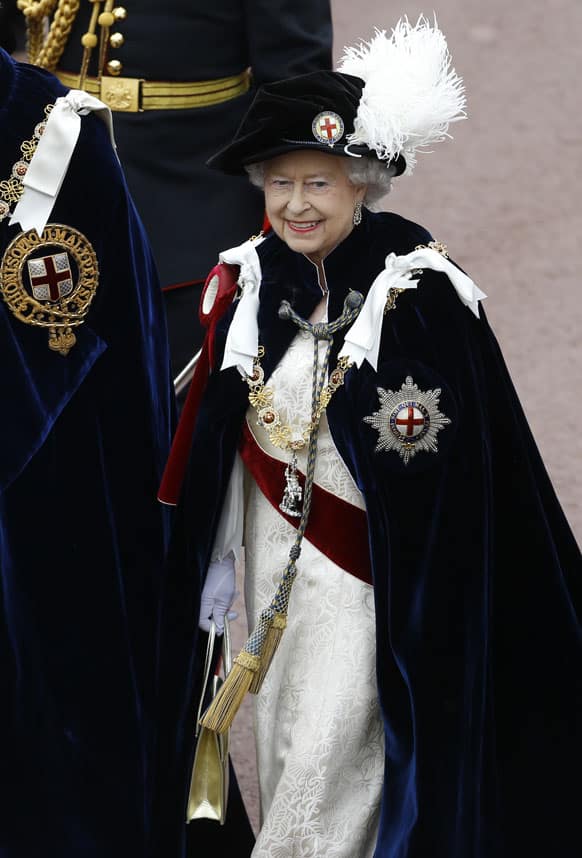 Britain`s Queen Elizabeth II walks in procession in the annual Garter Ceremony at Windsor Castle, England.