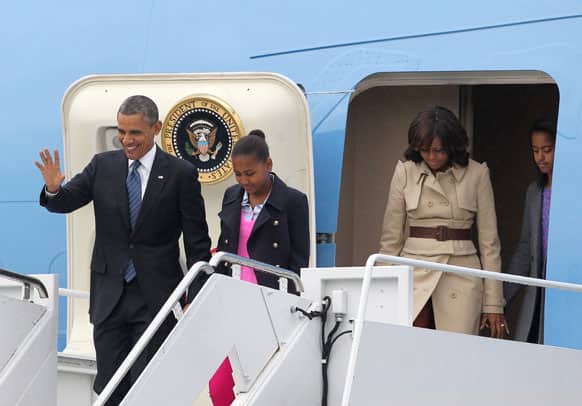 US President Barack Obama disembarks from Air Force One with his wife Michelle, daughters Sasha and Malia, upon arrival at Belfast International Airport, Northern Ireland.