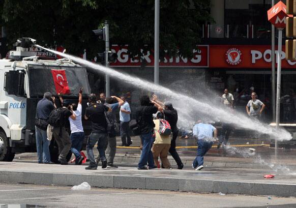 Turkish riot police spray water cannon at demonstrators who remained defiant after authorities evicted activists from an Istanbul park, making clear they are taking a hardline against attempts to rekindle protests that have shaken the country, in city`s main Kizilay Square in Ankara.