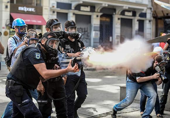 Police fire tear gas as riot police spray water cannon at demonstrators who remained defiant after authorities evicted activists from an Istanbul park, making clear they are taking a hardline against attempts to rekindle protests that have shaken the country, near city`s main Taksim Square.