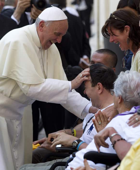Pope Francis blesses sick and disabled people at the end of a pro-life Mass in St. Peter`s Square, at the Vatican.