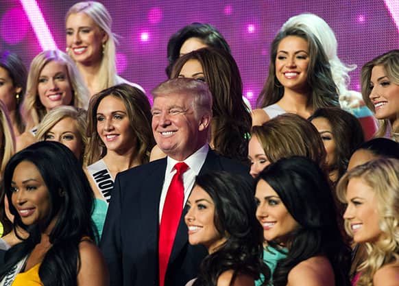 Donald Trump, co-owner of the Miss Universe Organization, poses for a photo with the competitors during rehearsal for the upcoming Miss USA Competition at PH Live in Las Vegas.